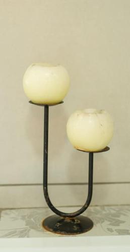two candles sitting on top of each other at HomeSweetHome Farm Cottage in Nelspruit