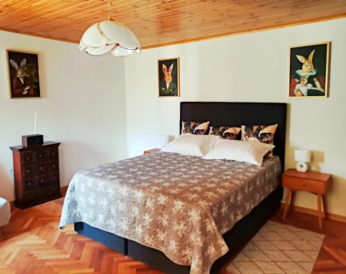a bedroom with a bed and a wooden ceiling at Pri Zajcu in Bovec