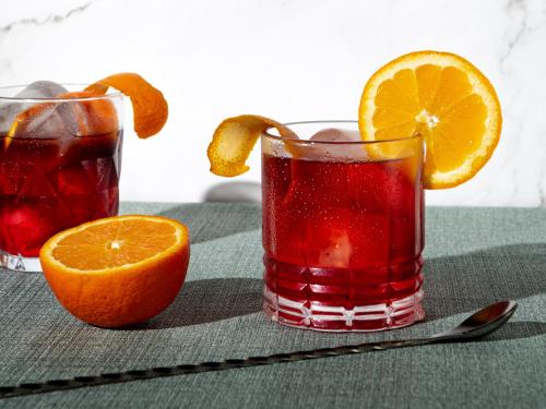 two glasses of orange juice and an orange slice at Whytescape Serviced Apartments in Abuja