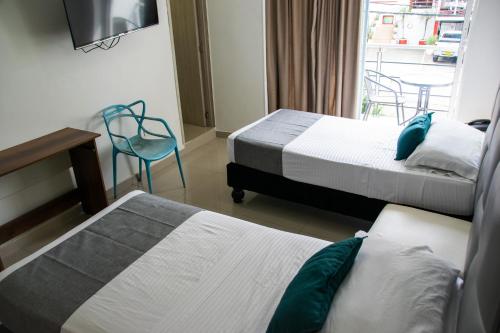 Cama o camas de una habitación en Hotel Granada Loft