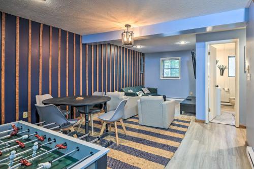 a living room with a ping pong table and a couch at Wraparound Deck Big Bass Lake Home in Gouldsboro in Gouldsboro
