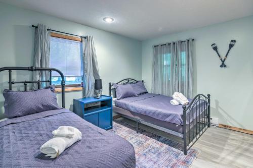 a bedroom with two beds and a window at Wraparound Deck Big Bass Lake Home in Gouldsboro in Gouldsboro