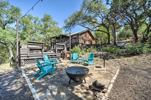 a patio with chairs and a grill and a house at Canyon Lake Hideaway with Fire Pit and Yard! in Canyon Lake
