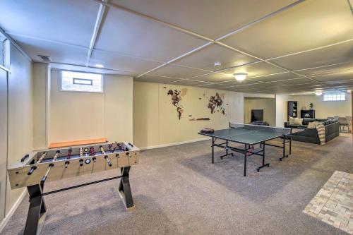 a room with a ping pong table and a couch at Cozy Abode about 3 Mi to Indiana Dunes Natl Park in Chesterton