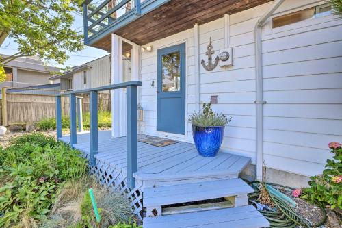 a blue door on a house with a porch at Waterfront Ferndale Home Deck and Beach Access in Ferndale