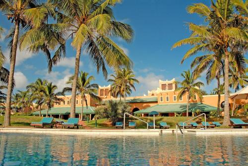 a resort with palm trees and a swimming pool at Avani Pemba Beach Hotel in Pemba