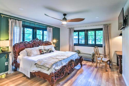 een slaapkamer met een groot bed en een ventilator bij Upscale Dickinson Getaway with Yard on 1 Acre! in Dickinson