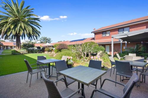 a group of tables and chairs on a patio at Julie-Anna, Bendigo in Bendigo