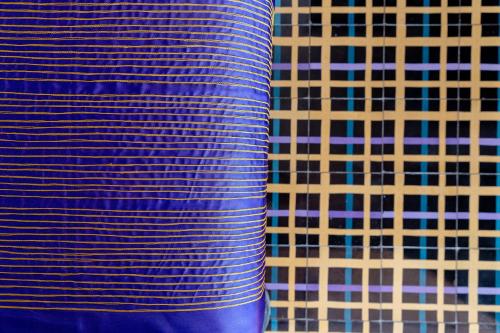 a close up of a blue and white tiled wall at Cabane Container Hotel - ADULTS ONLY in Puerto Escondido