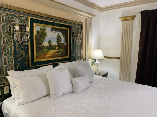 Säng eller sängar i ett rum på Hotel Inn Galerias