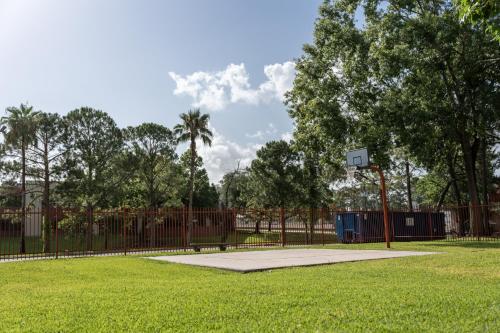 a basketball hoop in a park with a fence at GreenTree Hotel & Extended Stay I-10 FWY Houston, Channelview, Baytown in Channelview