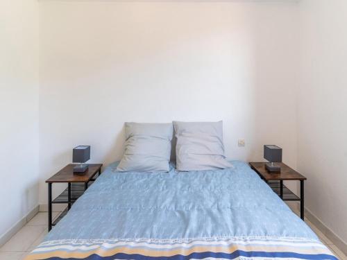 Una cama o camas en una habitación de Cosy holiday home in Minerve with garden