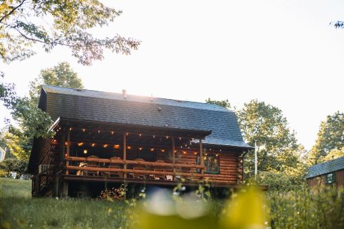 a log cabin with a black roof at Afton Cabin in Afton