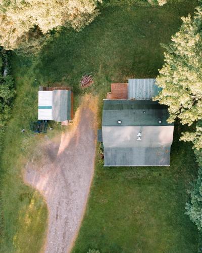 an aerial view of a building in the grass at Afton Cabin in Afton