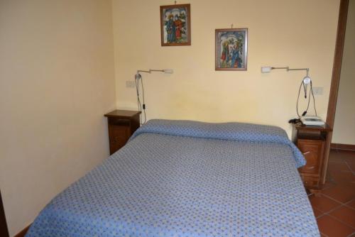 Postel nebo postele na pokoji v ubytování Hotel Valle dell' Oro