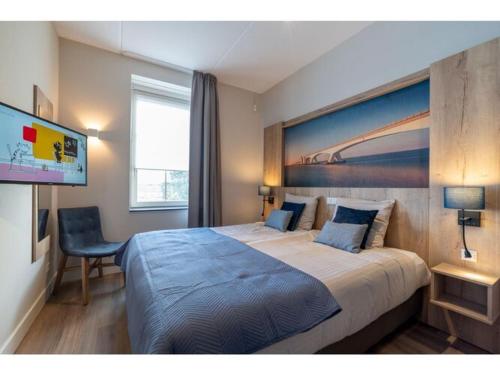 Postel nebo postele na pokoji v ubytování Premium apartment with private wellness in Zeeland