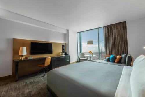 a hotel room with two beds and a television at InterContinental - Los Angeles Downtown, an IHG Hotel in Los Angeles