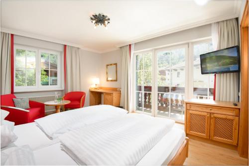 Кровать или кровати в номере Landhotel Römerhof