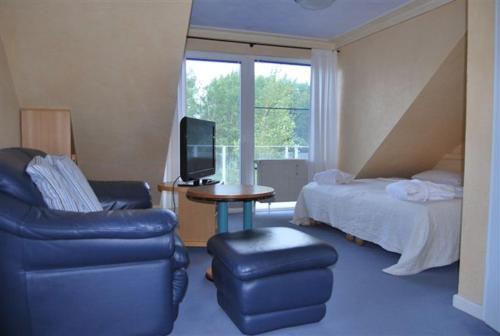 Μια τηλεόραση ή/και κέντρο ψυχαγωγίας στο Ferienwohnung ELDENA