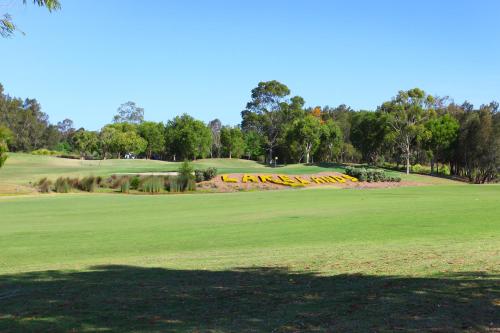 a view of the green at a golf course at Signature Waterfront Apartments in Gold Coast