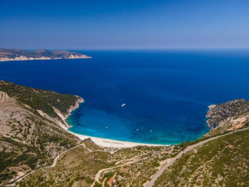 a view of the beach from a hill at Minas Apartments in Divarata