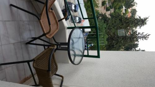 two tennis rackets and a mirror on a wall at Sylva Hotel in Limassol