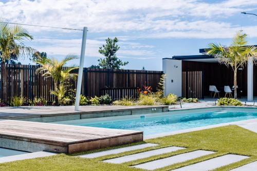 a swimming pool in the backyard of a house at Oceanview Retreat in Nelson