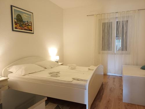 Postel nebo postele na pokoji v ubytování Apartments Verica