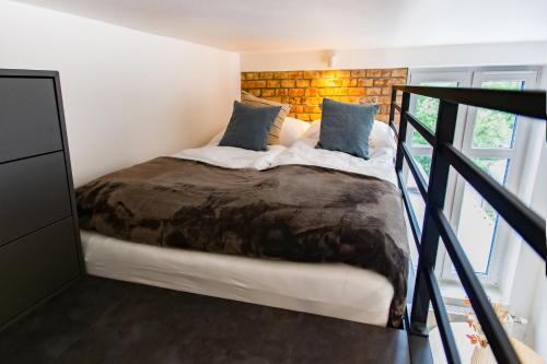 Posteľ alebo postele v izbe v ubytovaní Hillside7 Micro-Loft