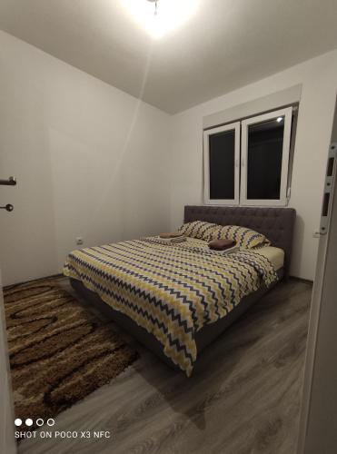 Postel nebo postele na pokoji v ubytování Apartman Đerić