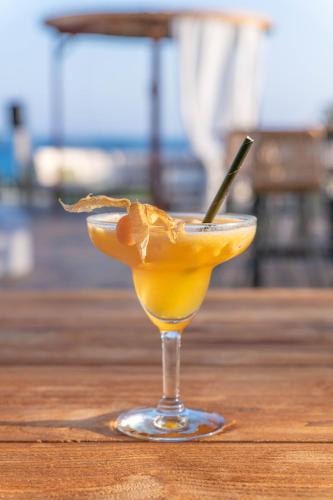 a margarita in a glass on a wooden table at Napa Mermaid Hotel & Suites in Ayia Napa