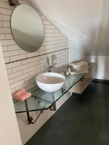 a bathroom with a sink and a mirror at Attico centro storico in Pavia