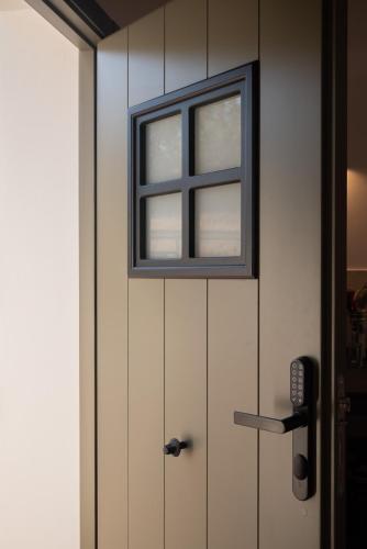 a window on a door with a phone next to it at Apartamento para pareja, Finca Contrabando. Sanlucar del Guadiana in Sanlúcar de Guadiana