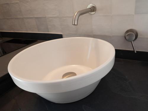 a white bowl sink with a faucet in a bathroom at Apartamento para pareja, Finca Contrabando. Sanlucar del Guadiana in Sanlúcar de Guadiana