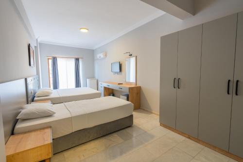 מיטה או מיטות בחדר ב-TURUNÇ LIFE HOTEL