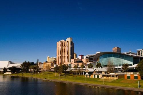 a view of a city with a river and buildings at 435/247 gouger st. ex hotel room in the city in Adelaide