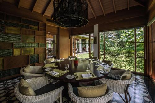 a dining room with a table and chairs at Alila Diwa Goa - A Hyatt Brand in Majorda
