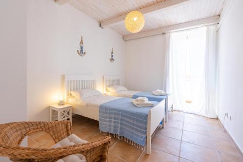 Posteľ alebo postele v izbe v ubytovaní Sea view New Apartment Ortigia