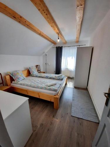 a small bedroom with a bed and a window at Retreat Activ in Cluj-Napoca