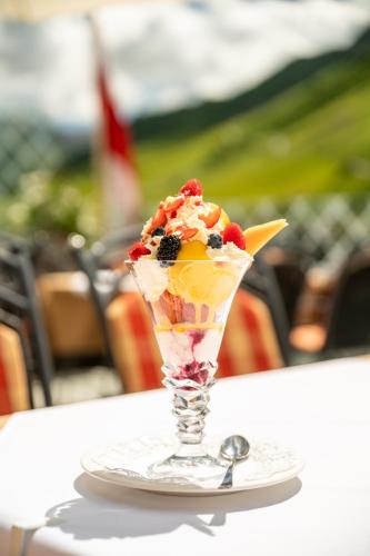 a dessert in a glass on a table at Hotel Enzian in Zürs am Arlberg