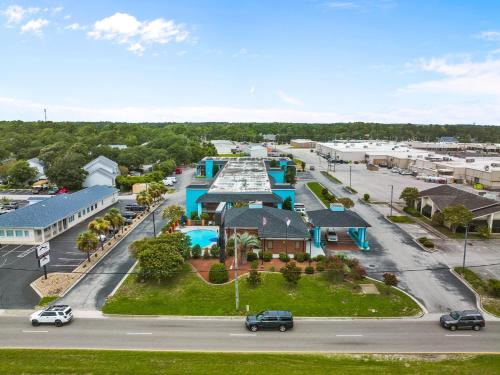an aerial view of a town with a parking lot at Garnet Inn & Suites, Morehead City near Atlantic Beach in Morehead City