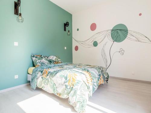 a bedroom with a bed and a wall with a tree mural at Fully renovated house only few minutes walk away from Ohama Beach in Vierville-sur-Mer