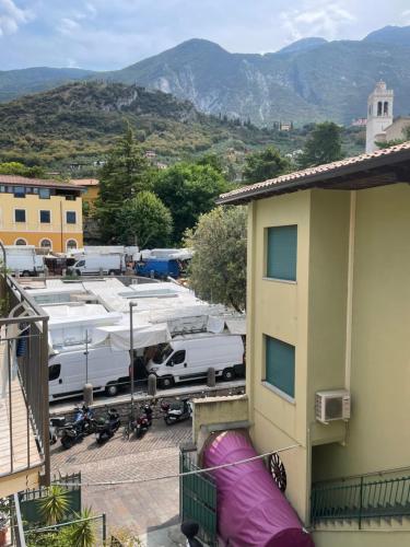a view of a parking lot with a building at Hotel Alpino in Malcesine