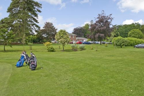 two motorcycles are parked in a grass field at Best Western Plus Kenwick Park Hotel in Louth