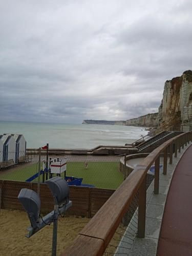 a view of the ocean and a beach at Aux prés verts in Fécamp