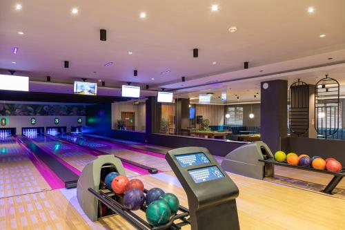 a bowling alley with balls on the lanes at Sudecki Resort & SPA in Karpacz