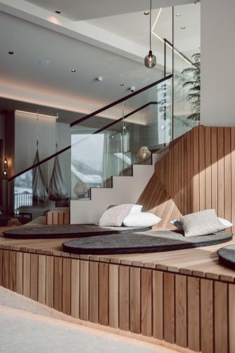 a bedroom with a large bed with pillows at JoAnn suites & apart in Kleinarl