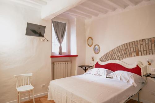 Ένα ή περισσότερα κρεβάτια σε δωμάτιο στο Piccolo girasole