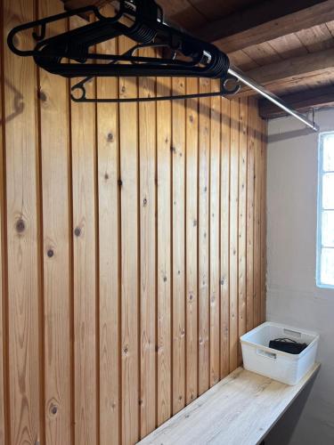 a room with a wood paneled wall with a box at AGApE in Keratea