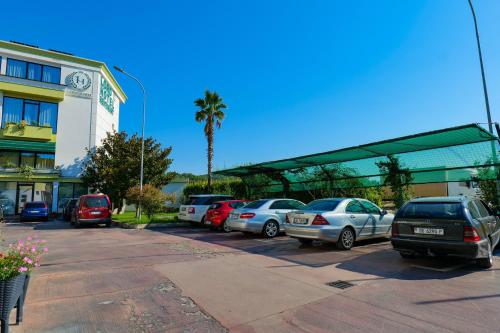 a bunch of cars parked in a parking lot at LORD Hotel in Tirana